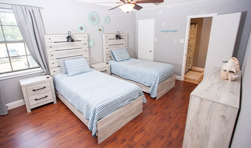 patient rooms with two beds and nautical theme