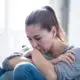 woman sitting on the ground isolated during COVID-19