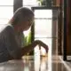 woman sitting at a bar with alcohol