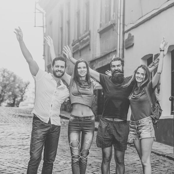 2 couples on cobblestone road b&w