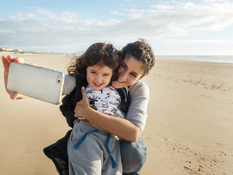 selfie mother and daughter beach