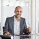 man with phone, laptop, notepad business