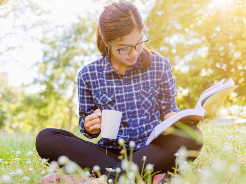 Young lady reading book