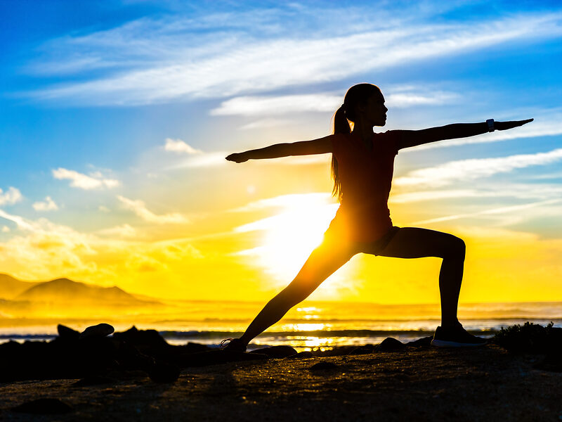 joga outdoors on shore