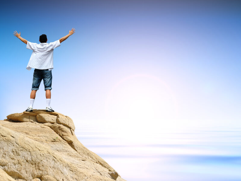 man on top of high mountain