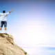 man on top of high mountain