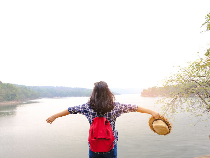 lake and lady spreading arms