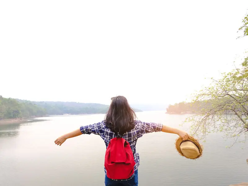lake and lady spreading arms