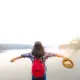 lake and lady spreading arms