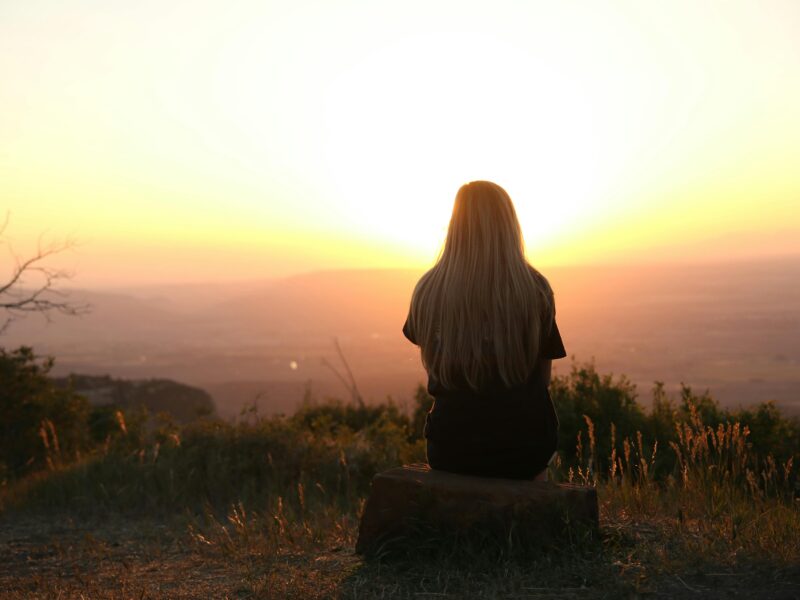 woman enjoying view sunset