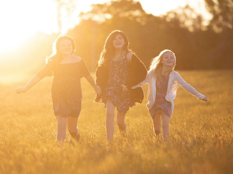 children running in grass