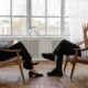 a therapist listening to a patient in a clinical setting.