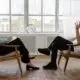a therapist listening to a patient in a clinical setting.