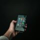 iphone with social media apps in a dark room