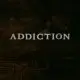 the word addiction on a dark wood background