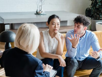 3 people sitting in a safe environment responding to an intervention