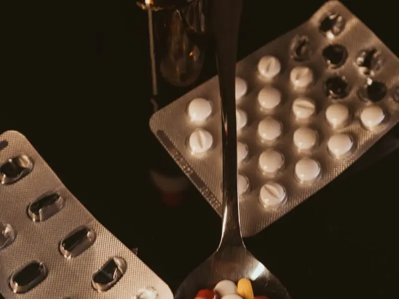 a multitude of drugs spread out on a table.